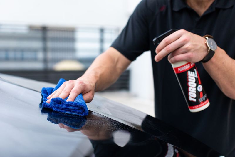 Vehicle paint being decontaminated and prepared for ceramic coating at Di Paulo's Auto Detailing in Fort Worth
